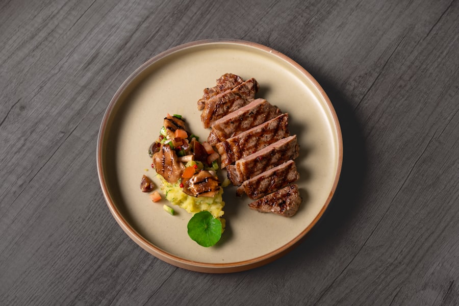 Sliced grilled steak with a side of vegetables